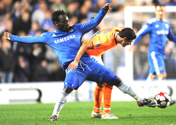 Chelsea's Michael Essien (left) challenges APOEL Nicosia's Pinto