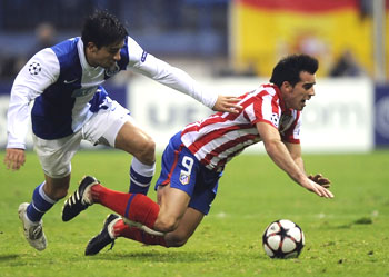 Porto's Fucile (left) challenges Atletico Madrid's Jose Manuel Jurado