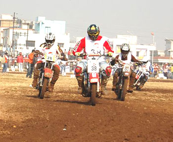 Freddy Elavia (centre) rides past Anish Nair (left) and Kallil Premjith