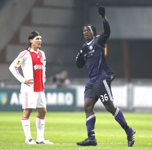 Anderlecht's Romelu Lukaku (right) celebrates his first goal as Ajax Amsterdam's Marko Pantelic puts on a grim look during their Europa League tie on Thursday