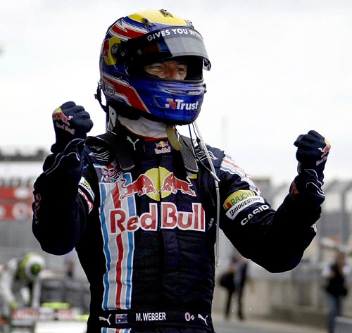 Red Bull driver Mark Webber of Australia celebrates his victory in the German F1 Grand Prix