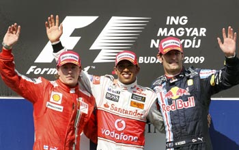 Race winner Lewis Hamilton (centre) with Raikkonen and Red Bull's Mark Webber on the podium