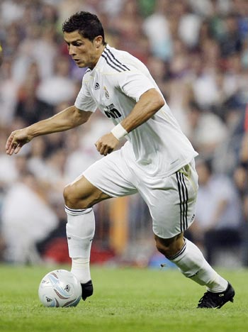 Real Madrid's Cristiano Ronaldo controls the ball during their Peace Cup match against Al Ittihad in Madrid