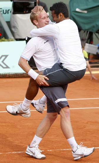 Leander Paes of India and Lukas Dlouhy of the Czech Republic celebrate after winning the final