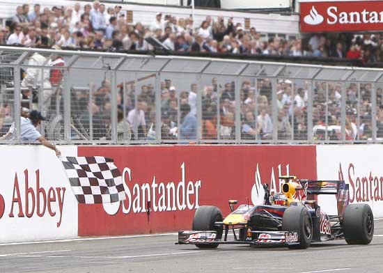 Sebastian Vettel crosses the finish line to win the British Grand Prix