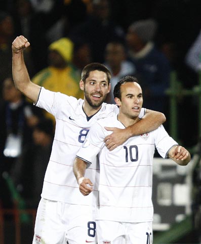 Landon Donovan of the US celebrates with Clint Dempsey after scoring against Brazil during the Confederations Cup final