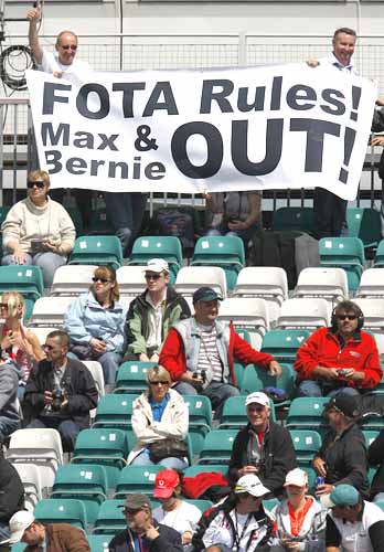 Fans hold up a banner against F1's commercial supremo Bernie Ecclestone and FIA President Max Mosley at Silverstone