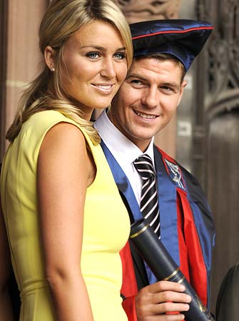 Gerrard and his wife Alex Curran pose for photographers before receiving his Honorary Fellowship degree from Liverpool University