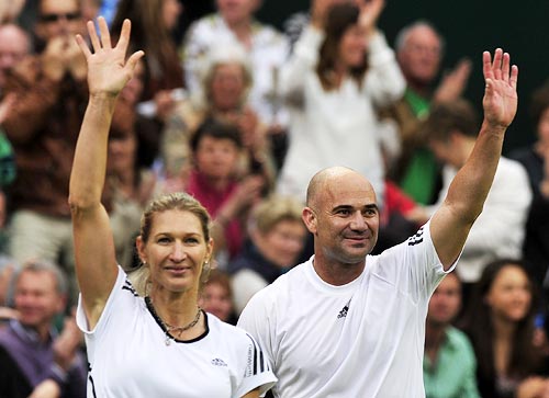Steffi Graf and Andre Agassi wave to the crowd