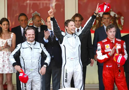 Jenson Button (center) along with 2nd-placed teammate Rubens Barrichello (left) and 3rd-placed Kimi Raikkonen