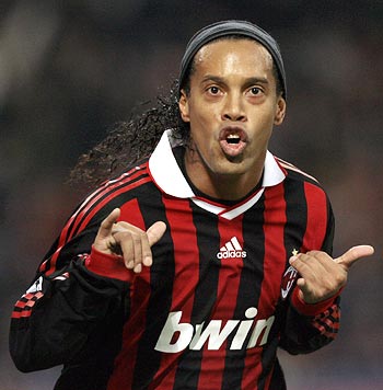 AC Milan's Ronaldinho celebrates after scoring against Real Madrid