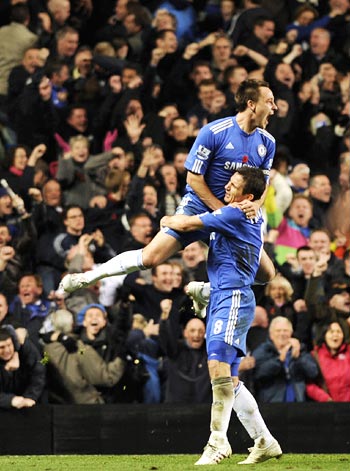 Chelsea captain John Terry is held aloft by Frank Lampard as they celebrate his goal