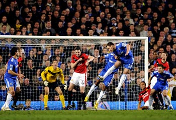 John Terry (4th right) scores against Manchester United