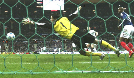 Ireland's Robbie Keane scores past French goalkeeper Hugo Lloris