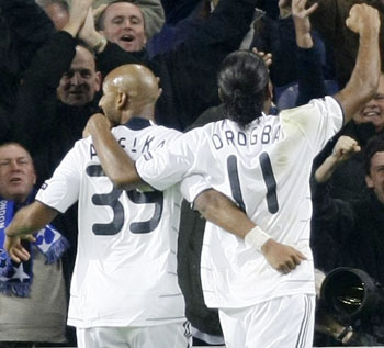 Chelsea's Nicolas Anelka celebrates with teammate Didier Drogba his goal against Porto