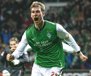 Werder Bremen's Mertesacker celebrates after scoring against VfL Wolfsburg during their Bundesliga match in Bremen on Saturday