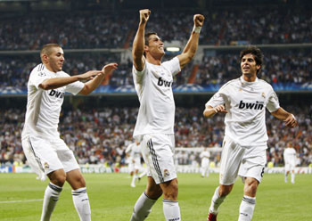 Real Madrid's Ronaldo celebrates his goal with his teammates Benzema and Kaka