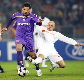 Varga of Debreceni challenges Mutu of Fiorentina during their UEFA Champions League soccer match in Budapest