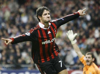 AC Milan's Pato celebrates his goal as Real Madrid's goalkeeper Casillas reacts during their Champions League match