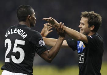 Manchester United's Antonio Valencia and Michael Owen celebrate after scoring a goal against CSKA Moscow