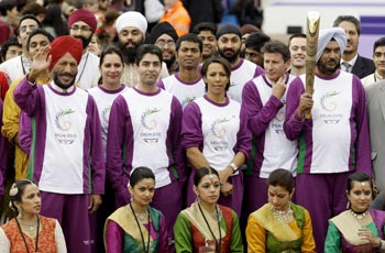 Athletes stand outside Buckingham Palace during the launch of the 2010 CW Games baton relay