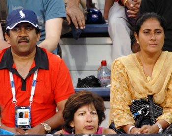 Former Indian cricket team manager M Chamundeshwarnath (left) with Sania Mirza's mother Naseem