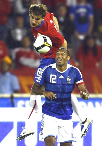 France's Thierry Henry (right) vies for possession with Serbian defender Ivanovic