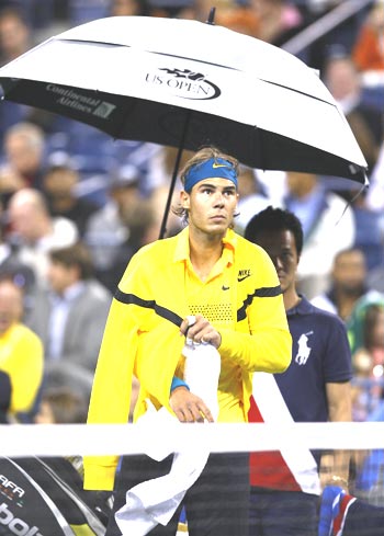 Rafael Nadal takes cover