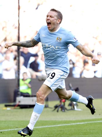 Manchester City's Craig Bellamy celebrates after scoring against Arsenal