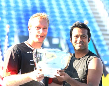 Newly-crowned US Open doubles champions Leander Paes and Lukas Dlouhy with the trophy