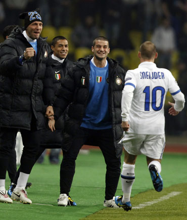 Wesley Sneijder reacts after scoring the goal