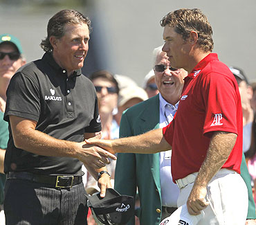 Lee Westwood (right) congratulates Phil Mickelson