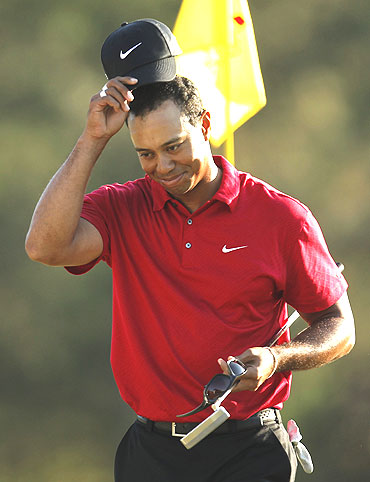 Tiger Woods acknowledges the crowd after finishing his final round of play