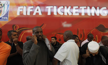 South Africans queue to buy tickets for the 2010 FIFA World Cup in Soweto