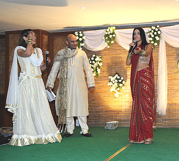 Bollywood actress Neha Dhupia entertains the crowd during the Sangeet ceremony