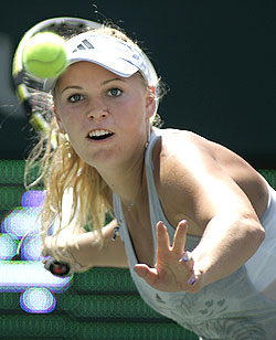 Caroline Wozniacki returns a volley during her match against Patty Schnyder at the Family Circle Cup Tennis Tournament in Charleston