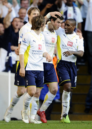 Gareth Bale celebrates with team-mates after scoring