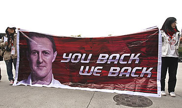 Fans of Schumacher hold a banner at the Chinese F1 Grand Prix in Shanghai on Sunday