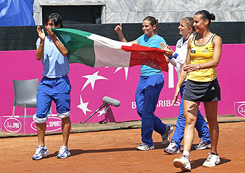 Italy's Francesca Schiavone (left) Roberta Vinci (2nd left), Sara Errani and Flavia Pennetta (right) celebrate after winning their Fed Cup World Group semi-final match against Czech Republic