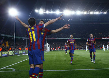 Barcelona players celebrate after a goal