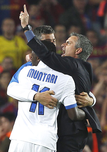Inter Milan's coach Jose Mourinho (right) celebrates with his players after qualifying for the Champions League final