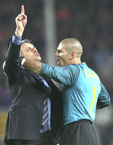 Jose Mourinho (left) gets into a tussle with Barcelona goalkeeper Victor Valdes as he celebrates after qualifying for the Champions League final