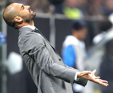 Barcelona coach Guardiola reacts during the match against Inter Milan