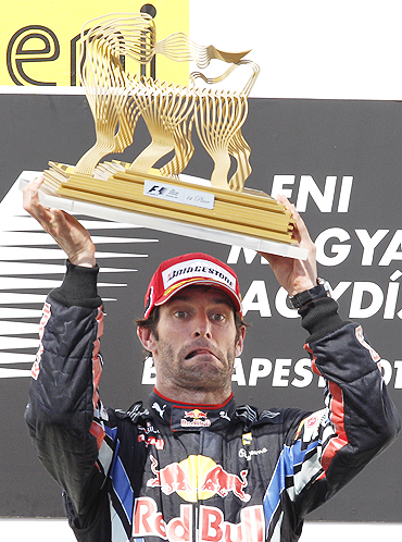 Mark Webber with his trophy