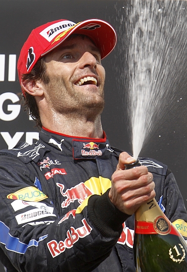 Mark Webber celebrates his win in Hungary
