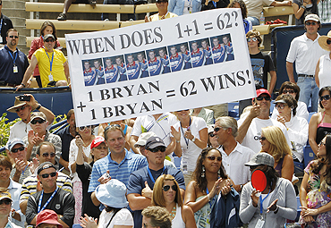 Fans of the Bryan twins hold a placard during the final on Sunday