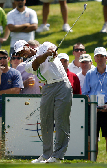 Tiger Woods hits his tee shot on the seventh hole during first round play at the WCG Bridgestone Invitational