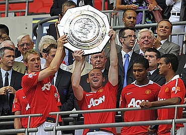 Manchester United players celebrate after winning Community Shield