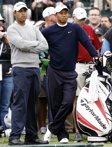Arjun Atwal (left) with Tiger Woods