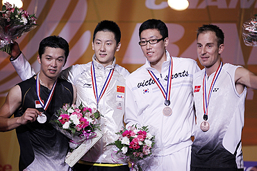 Indonesia's Taufik Hidayat, China's Chen Jin, South Korea's Park Sung-hwan and Denmark's Peter Hoeg Gade pose on podium after receiving their medals at the 2010 Badminton World Championships in Paris on Sunday